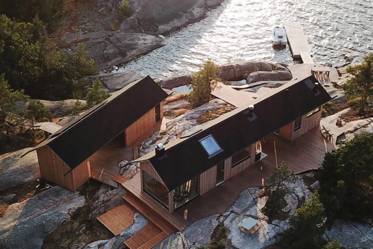 In order to work with the rocky conditions of the landscape and the strict building rules, the duo came up with an initial design for two self-sustaining timber dwellings