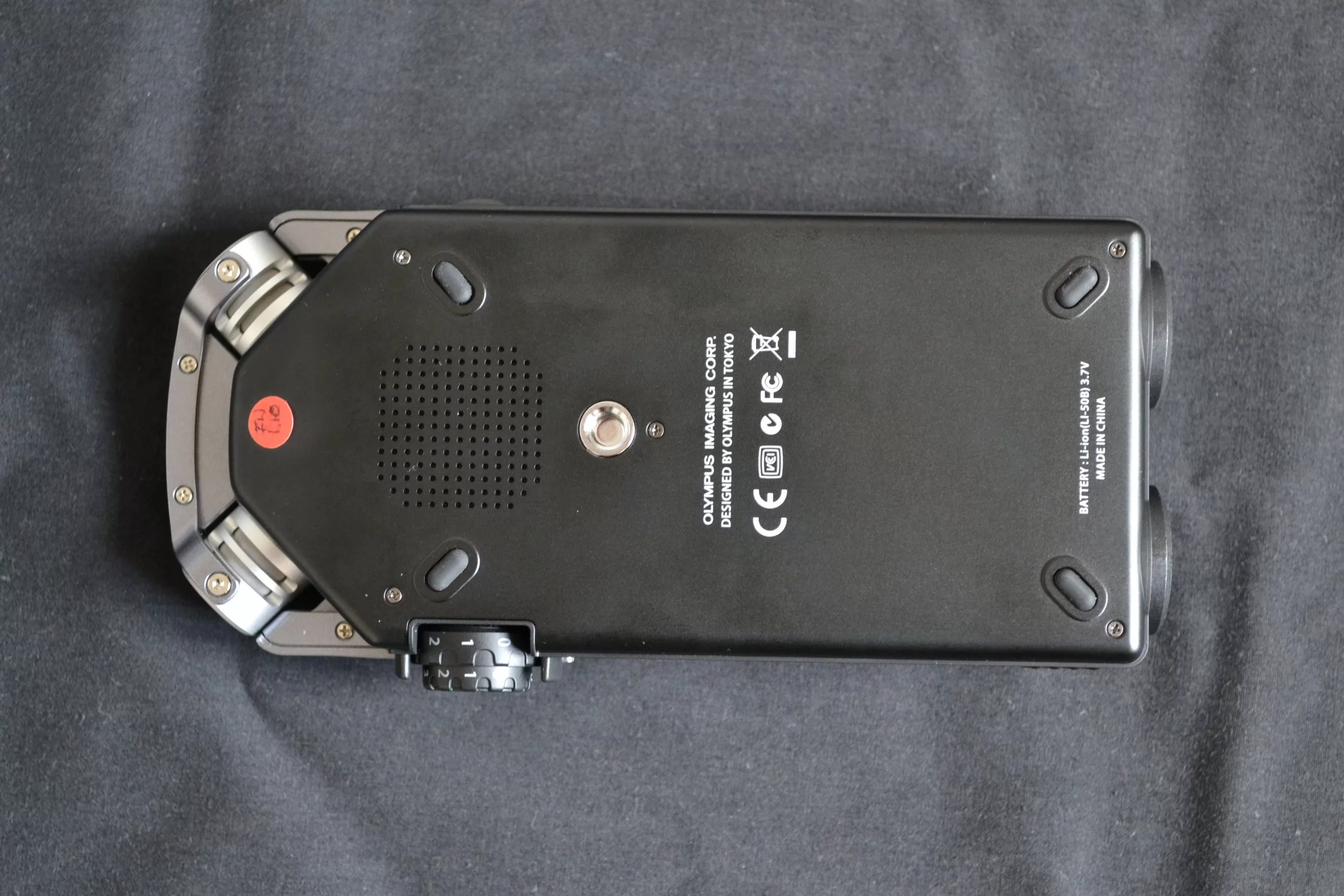 To the rear is a 23-mm round dynamic mono speaker and a tripod mount screw hole