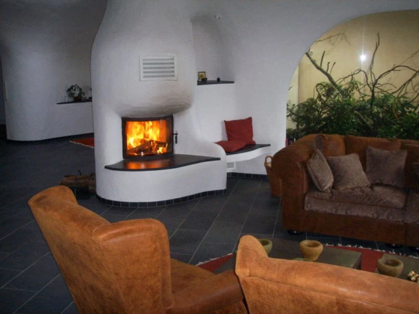 The interiors of the Earth Houses by Vetsch Architektur are as homely and comfortable as more traditional buildings