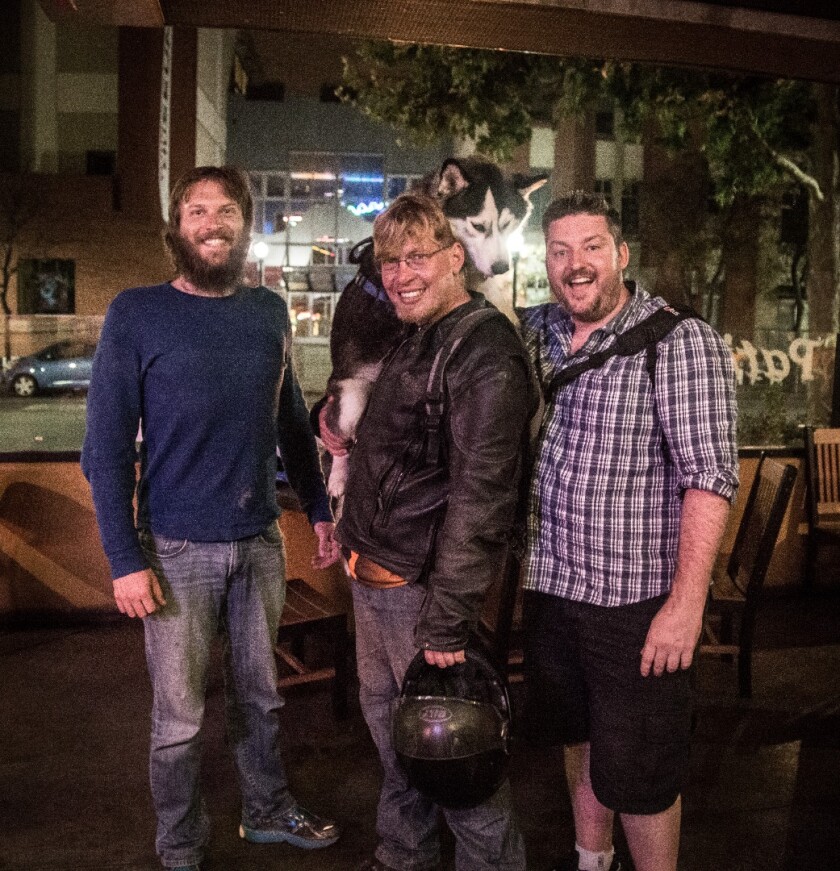 Luke Workman, Terry Hershner, Charger and Loz Blain grab some pizza in Santa Cruz