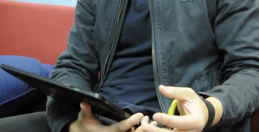 Digits interacting with a tablet