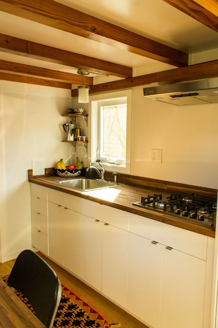 The fully equipped kitchen is large and spacious, featuring lots of preparation and storage space