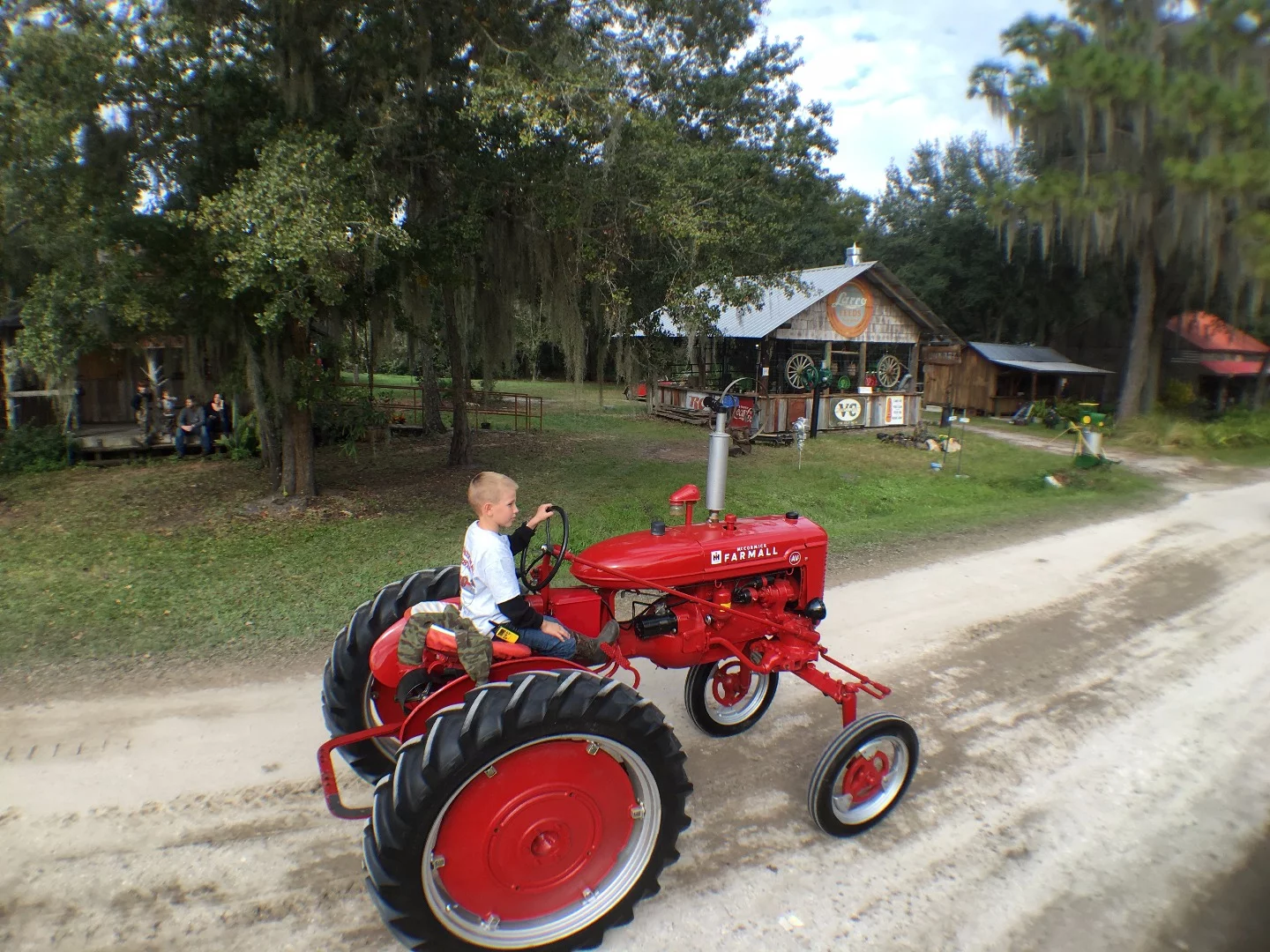 All in the family - Hunter Cheshire of West Palm Beach, FL drives a Farmall AB in the tractor parade.