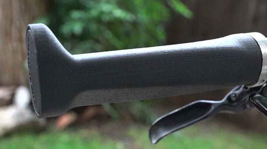 The wings at the ends of the grips allow the outside edge of the hand to press the bike down on the inside when cornering, thus leaning the bike more and tightening its turning radius