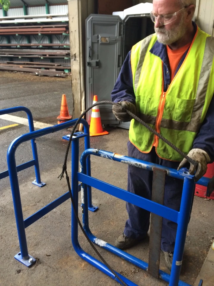 Inside of the rack's piping runs a length of free-floating steel wire cable