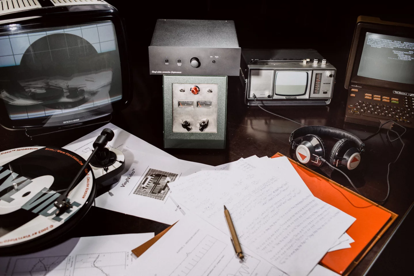 The VinylVideo Converter (center top) sits between a regular record player and a regular TV and converts the analog signal picked up by the stylus into something that the television can read and output as sound and video