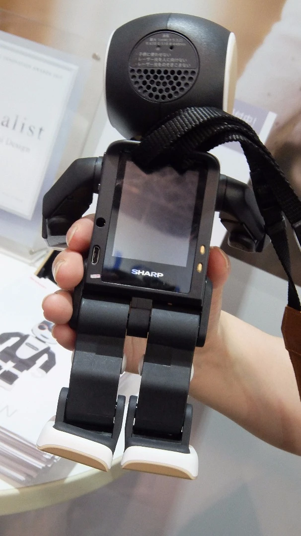 The back is like a small smartphone, with a 2 inch QVGA touchscreen and additional select buttons