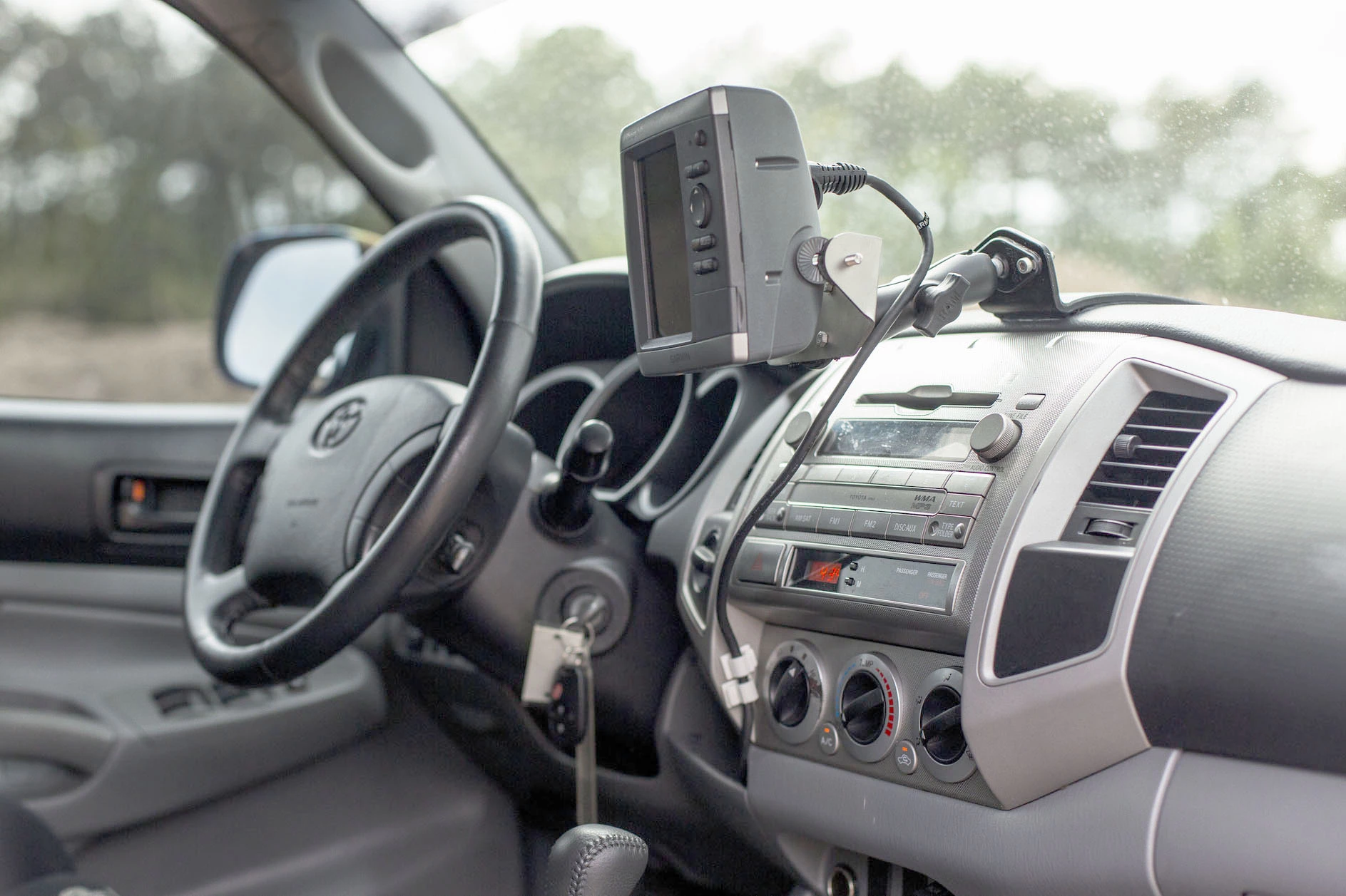 The 2010 Toyota Tacoma Polar Expedition as it will be auctioned is decked out in a NATO Green vinyl wrap over a Graphite interior with 14,281 miles on the odometer