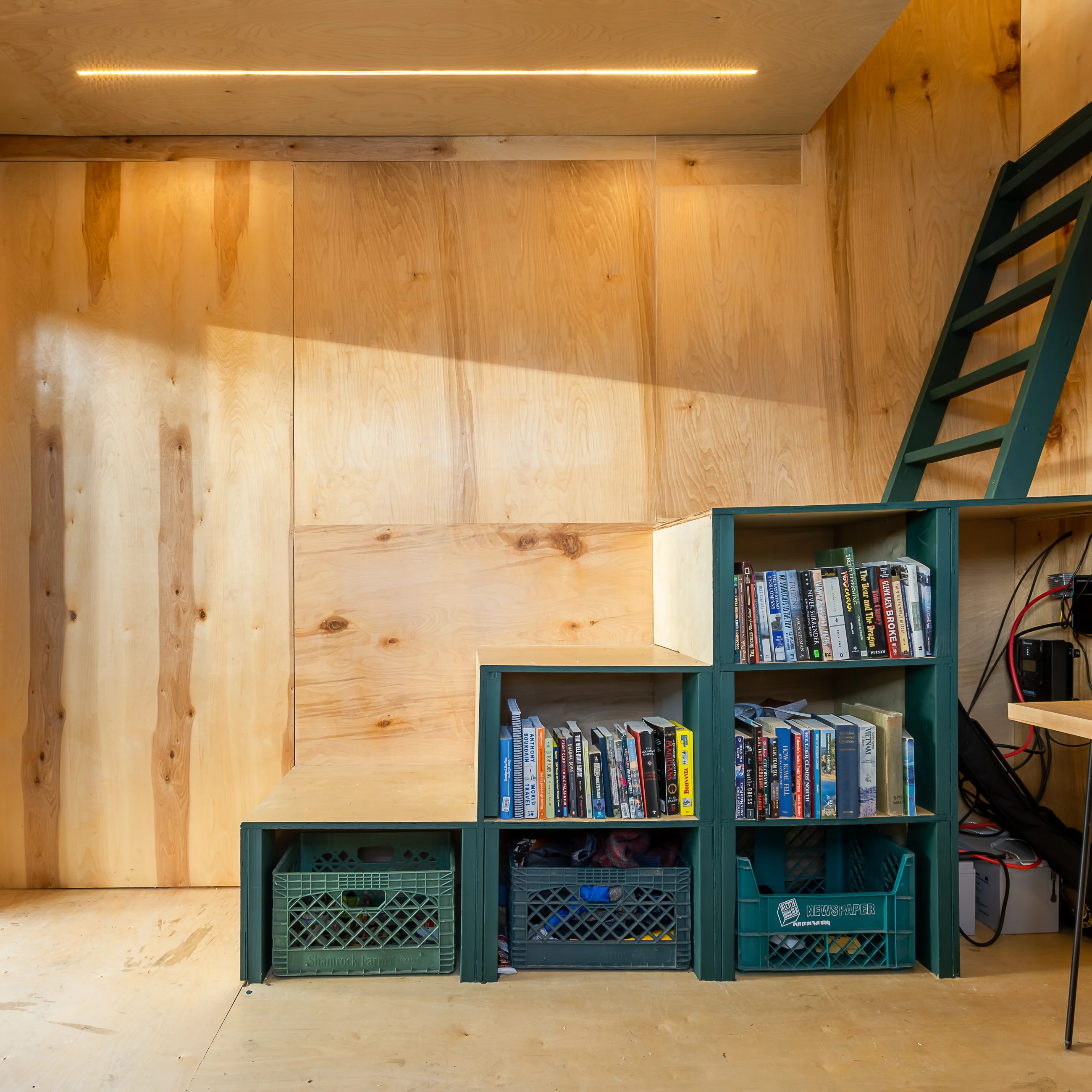 The Magnolia Eco-Cabin's upstairs is reached by storage-integrated staircase