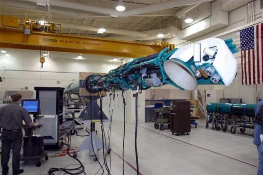An LMRS system consists of two 20-foot long unmanned underwater vehicles a 60-foot robotic recovery arm onboard handling equipment support electronics a shore-based depot and a special van to transport the vehicle.