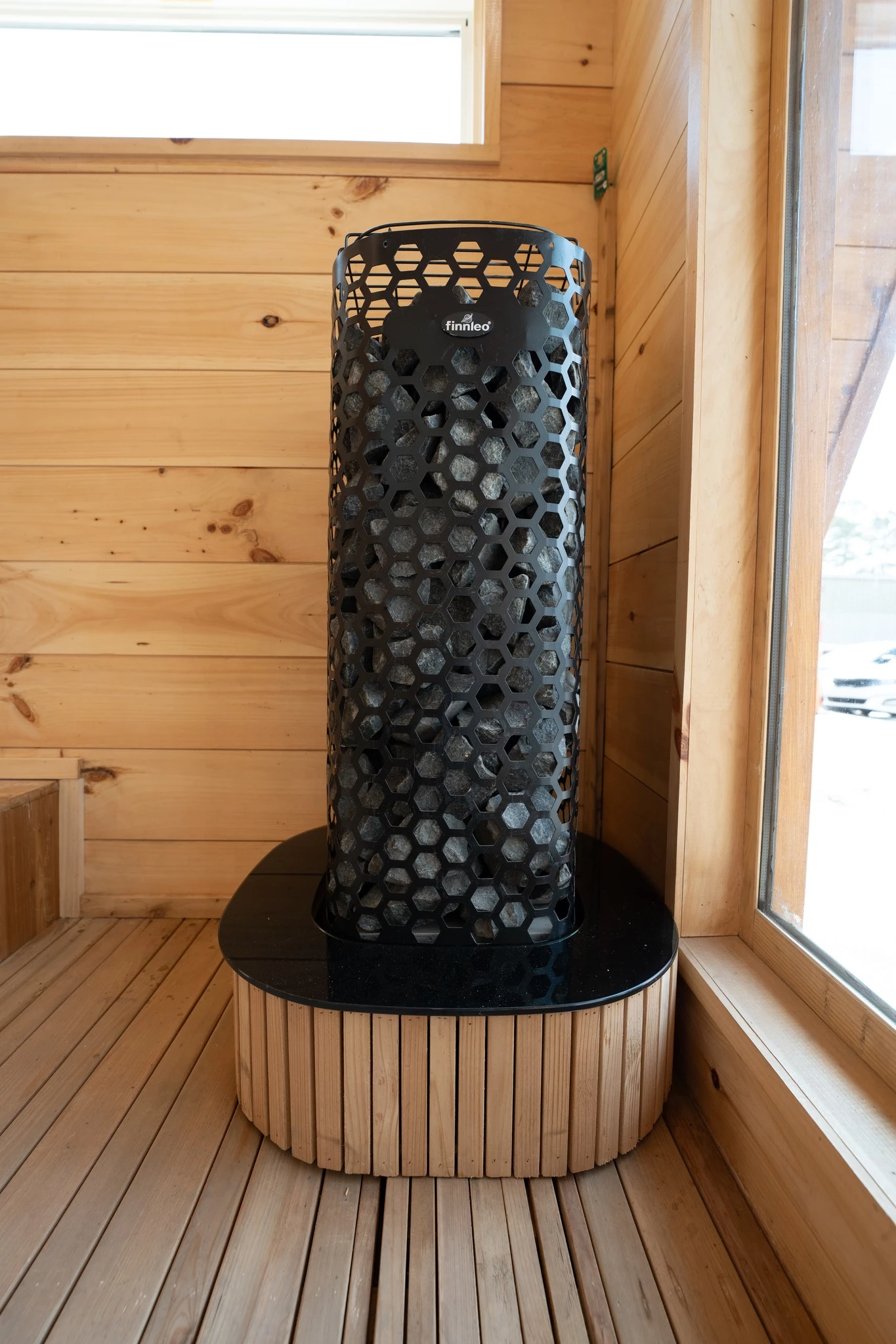 The tiny house sauna includes a Finnelo heater, as shown, though others are also optionally available