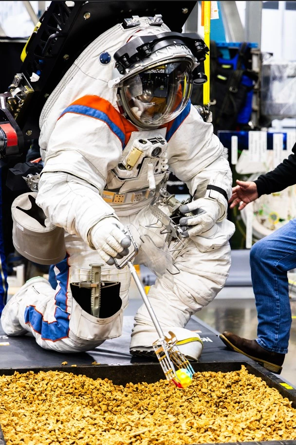 The suit allows astronauts to kneel and squat