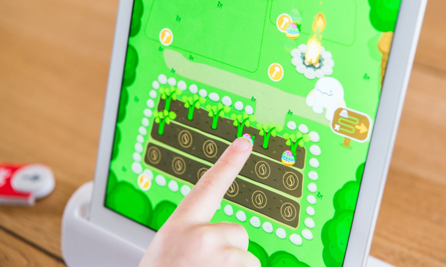 In addition to using the code blocks to control Awbie in Osmo Coding, there is still some traditional finger on screen action
