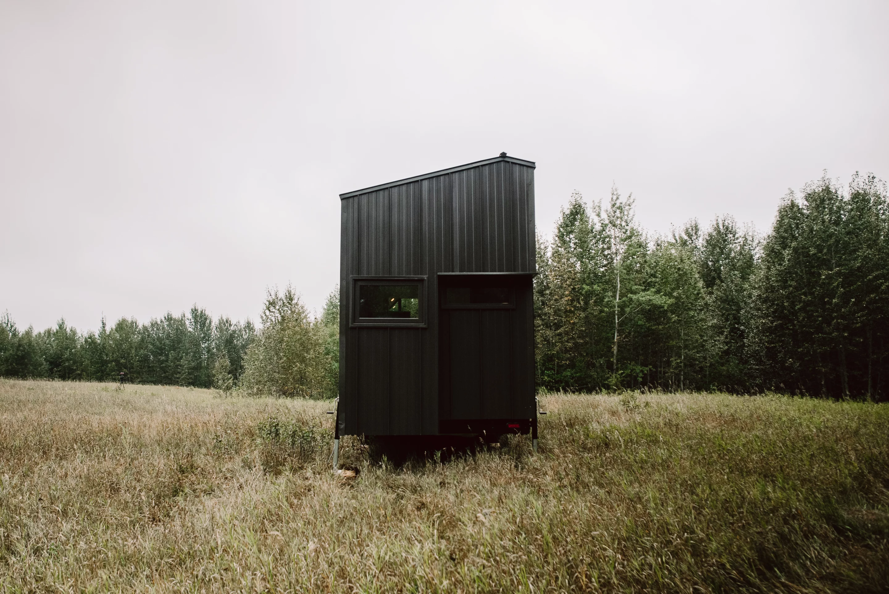 The Trahan Tiny House's exterior is finished in Douglas fir wood and metal siding