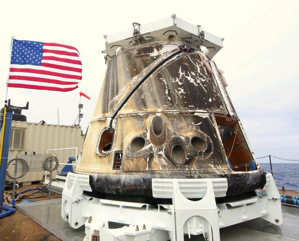 The Dragon capsule after being retrieved from the Pacific Ocean after splashdown