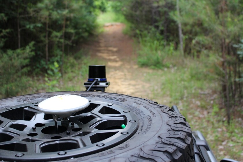 A GPS antenna and LiDAR sensor are visible on a data collection run on MSU's off-road track