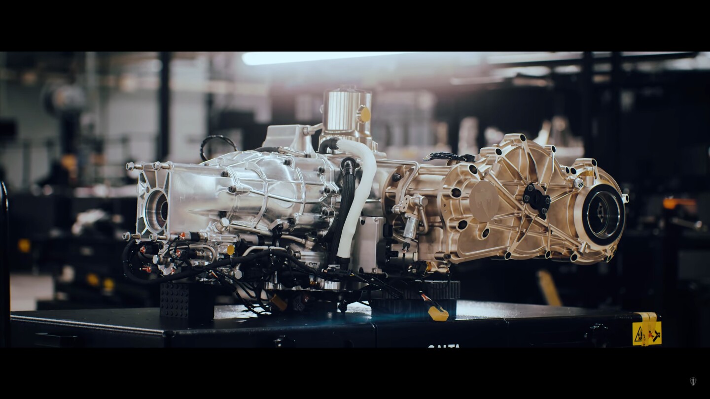 The front of Koenigsegg's Light Speed Tourbillon Transmission (LSTT), left, has an output shaft for front wheel power – to the right, you can see the output flange for the rear-left wheel