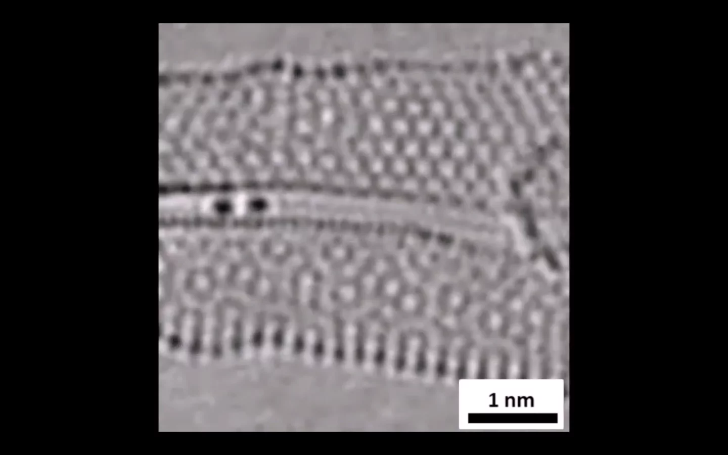 Researchers have imaged atoms (dark spots on left) forming and breaking bonds for the first time