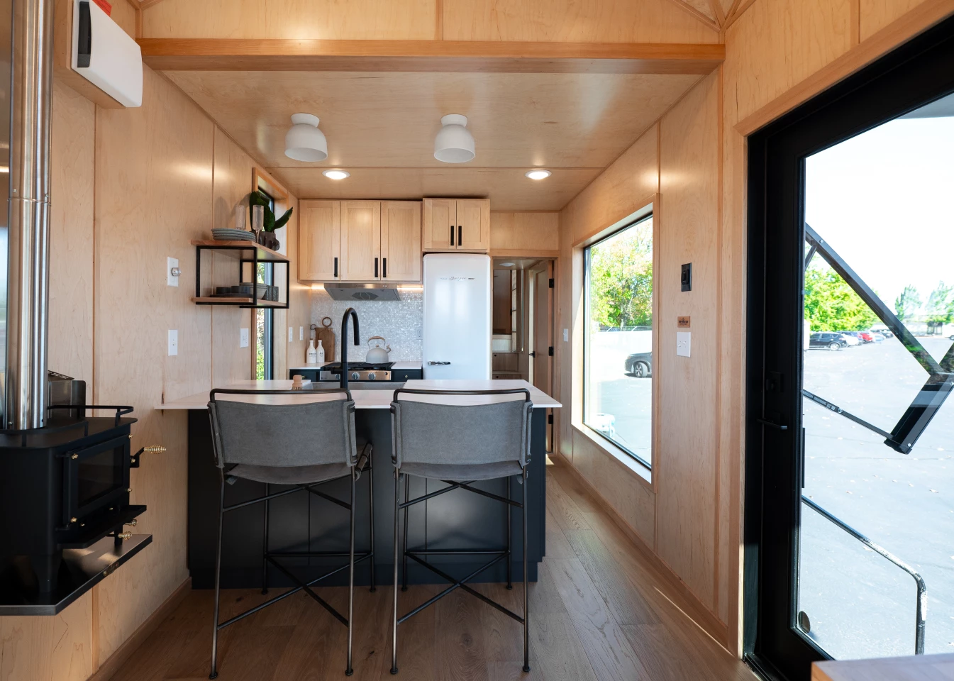 The kitchen includes seating for up to two people