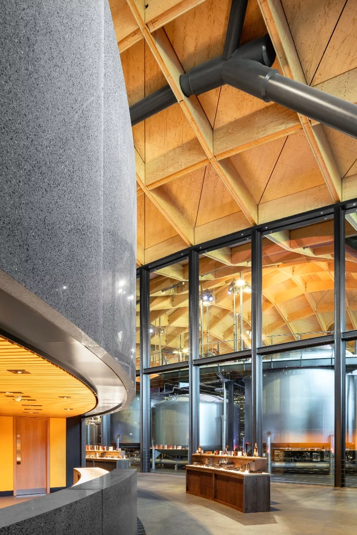View of the glazed compartment wall between the Visitor Experience and the production Still Houses in the Macallan New Distillery and Visitor Experience