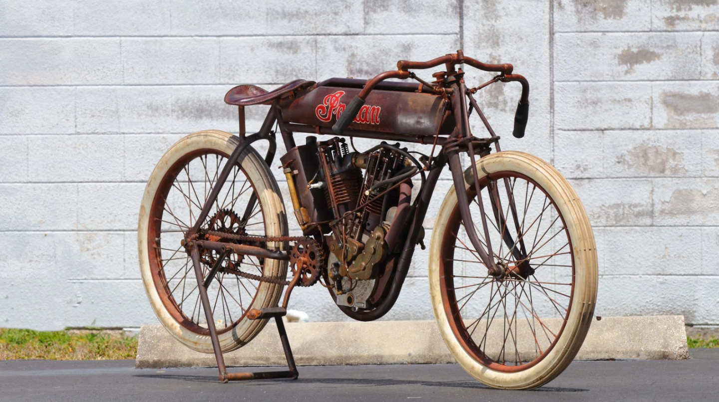 This 1914 Indian 8-valve Racer is a perfect example of Indian's production racer of the period which was fearsome fast. The 8-valve was a dominant force on the board tracks of the period, and one was timed at 114.17 mph in 1920. That's a 1000cc v-twin engine with four valves per cylinder. This lot was sold "as raced" and retained it what is estimated to be 70 percent of its original paint. In perfect running condition. Auction Description
