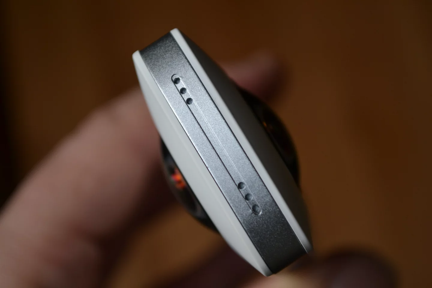 The six small indents to the top of the camera, which have been confirmed as dual microphones (not yet activated)