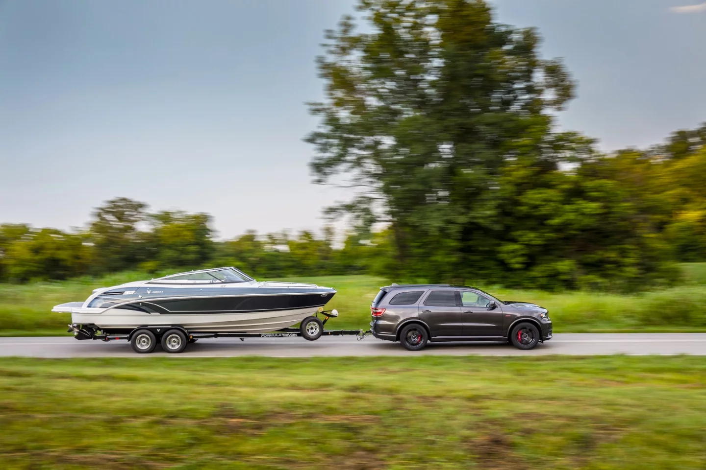 Only in America would the need for a muscle car that hauls six people and tows a boat be addressed