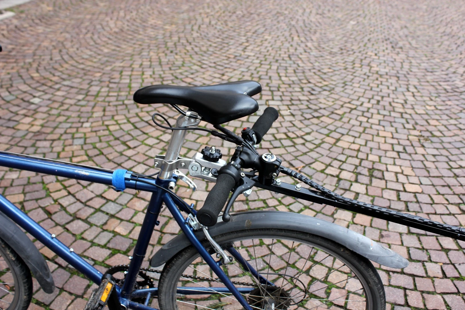 The integrated handle turns bicycle trailer into hand cart