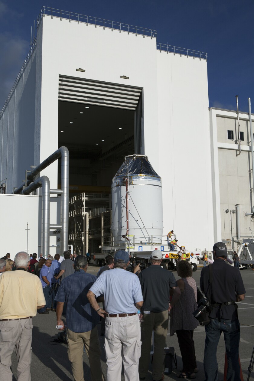 The Orion crew module and service module moves out of the Neil Armstrong Operations and Checkout Building at NASA’s Kennedy Space Center (Image: NASA/Dan Casper)