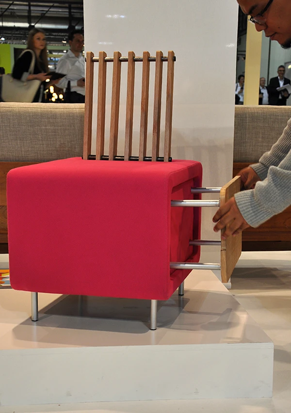A coffee table slides into the side of the arm chair for storage (Photo: Edoardo Campanale/Gizmag.com)