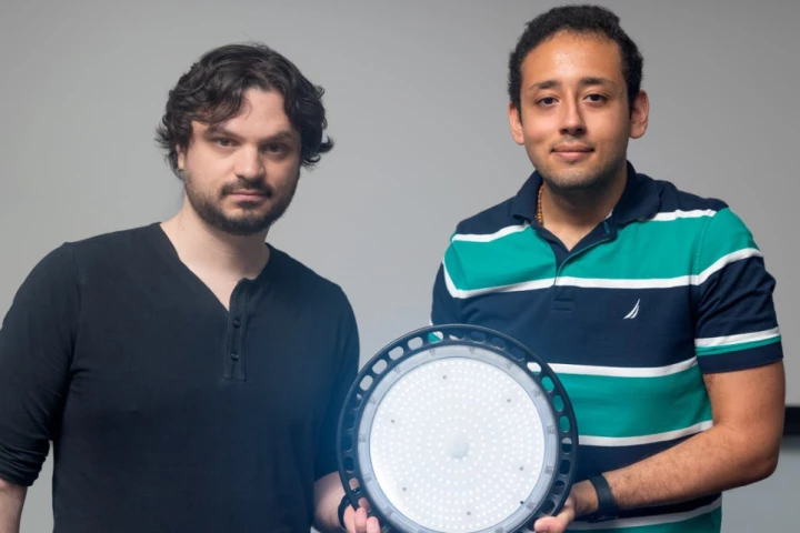 Asst. Prof. Abe Davis (left) and computer science grad student Peter Michael with an NCI-code-generating light