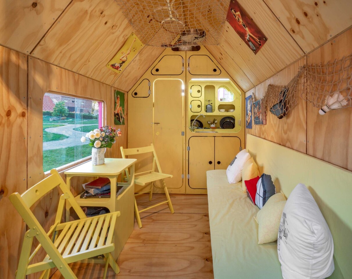 The Magenta tiny house includes a sofa bed