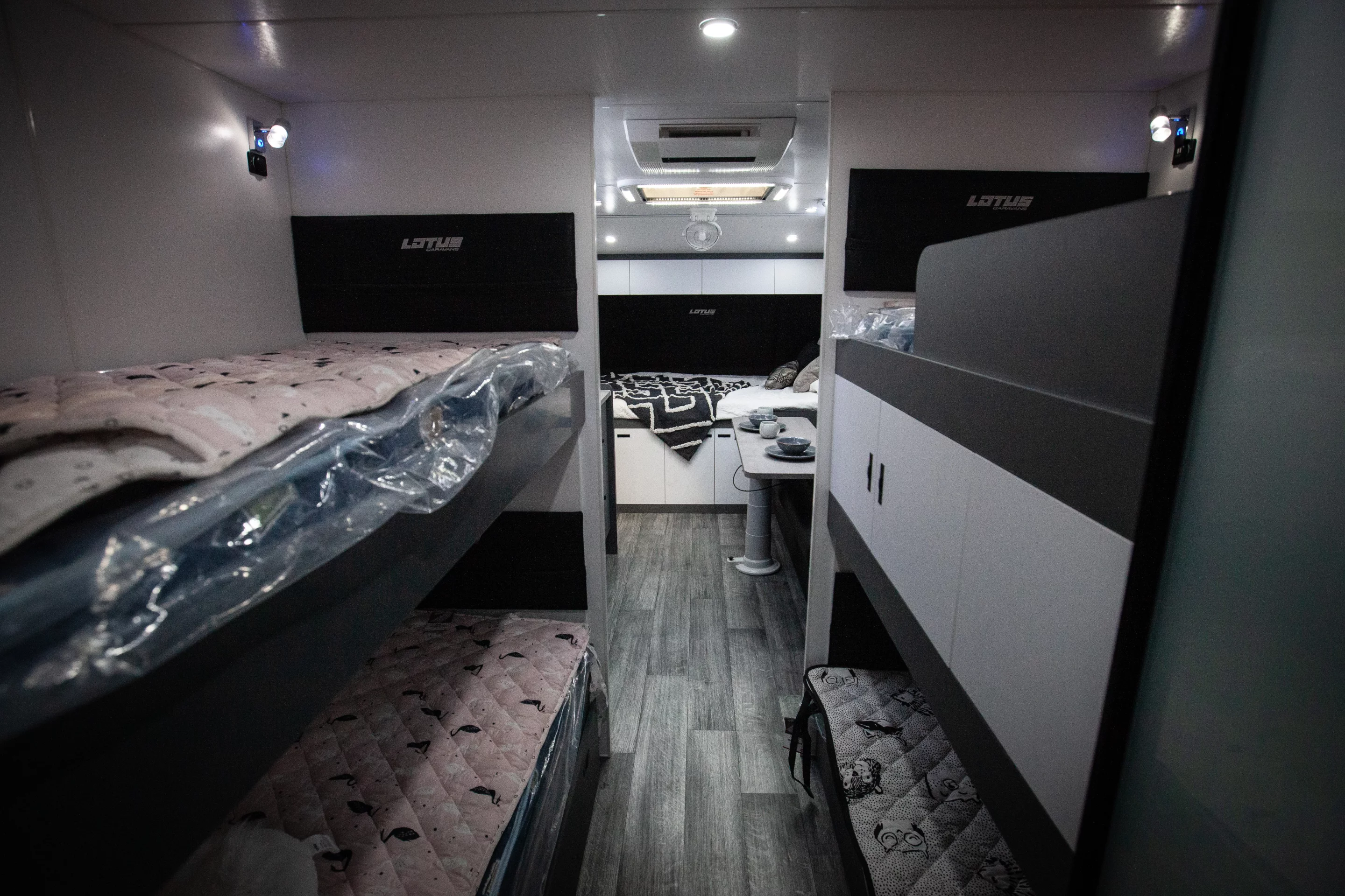 With four bunk beds near the back, this 23-foot Lotus Off Grid sleeps a family of six