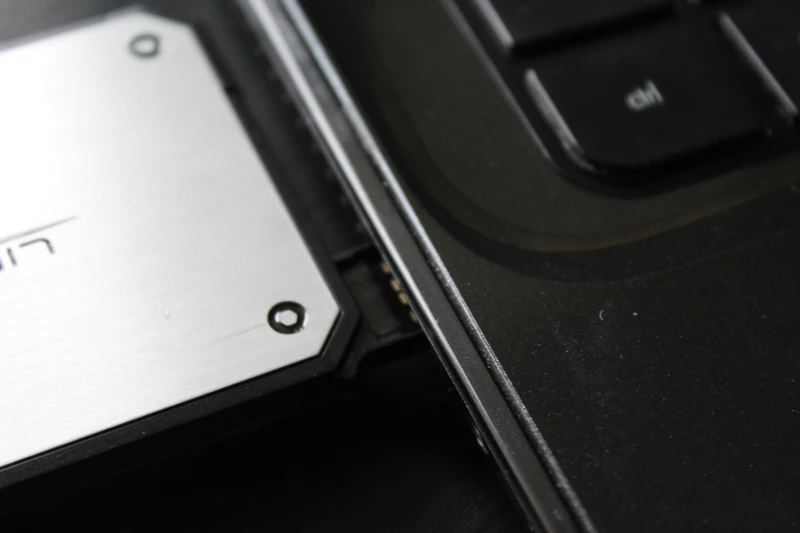 The device slots into a computer for charging