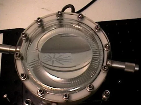 Having done its job, Saul's desktop machine produces the final lens