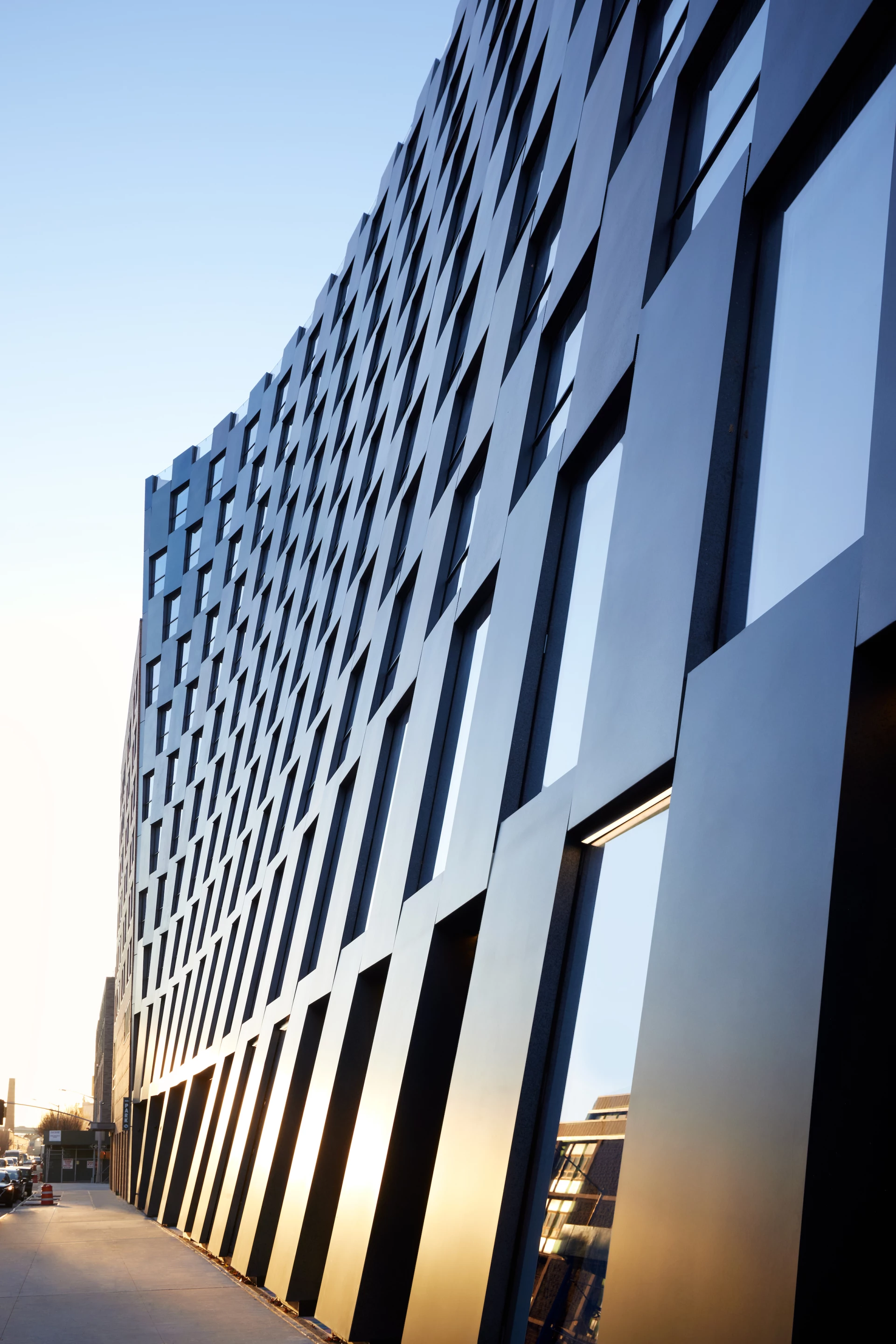 "The Smile’s facade takes inspiration from the textured surface of the moon, and blends with the black and red brick of the existing buildings in the neighborhood," says BIG