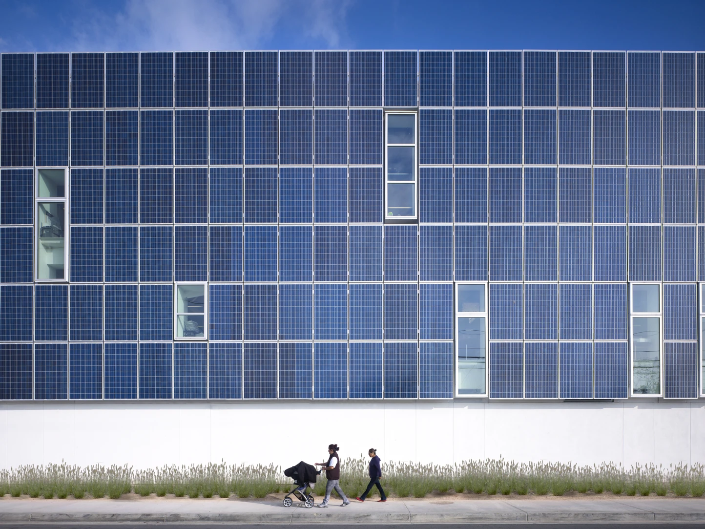 The school is characterized by its large south facing façade, covered with 650 solar panels