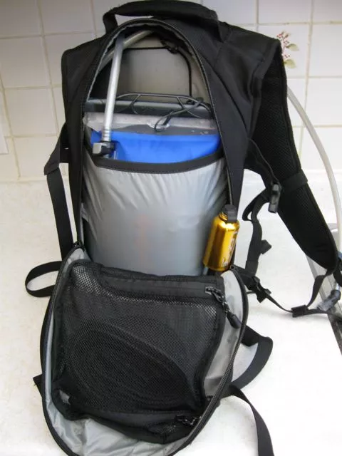 The GEIGERRIG bladder sits in a separate nylon pouch within the pack, leaving room for gear such as a bike pump and extra tube (in the mesh pocket)
