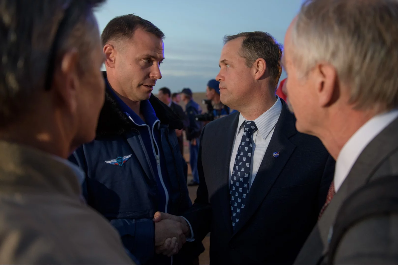 Expedition 57 Flight Engineer Nick Hague of NASA, left, is welcomed by NASA Administrator Jim Bridenstine after Hague landed at the Krayniy Airport
