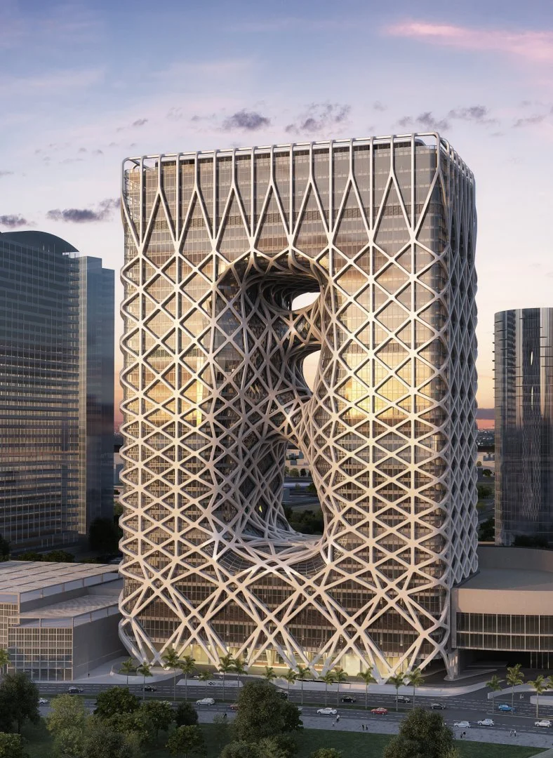 The oddly-skinned structure by Zaha Hadid Architects, with its white elastic wrapping element, features a similar exterior narrative to the Beijing Olympics National Stadium (Bird’s Nest)