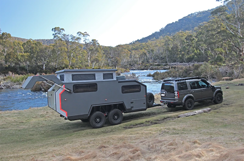 With the push of a button in the outside electrical panel, the tailgate pops open to reveal the entry door