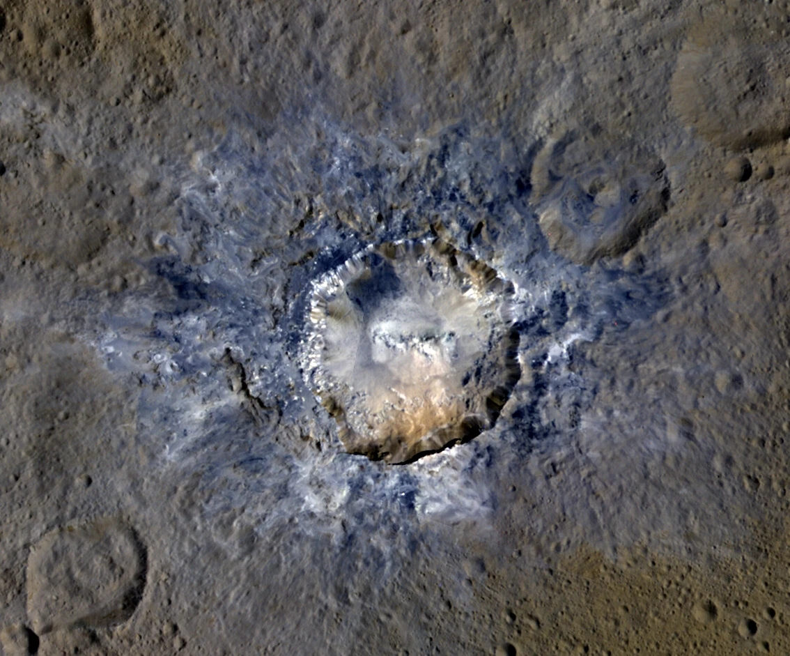 Bright debris surrounding the 21-mile-wide (34 km) Haulani Crater on Ceres
