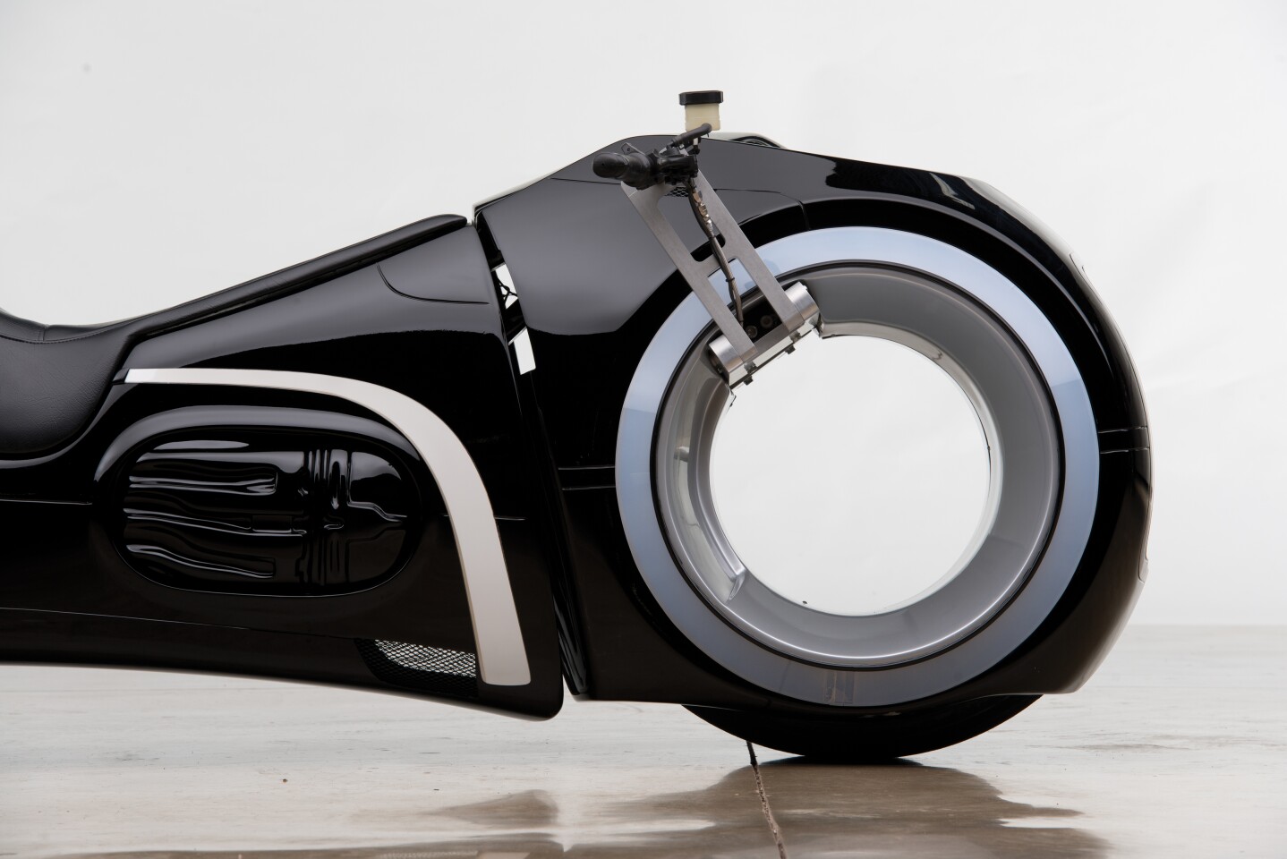 The front wheel and handlebars of the Andrews Collection TRON: Legacy light cycle