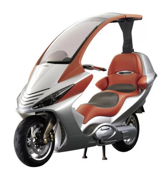 Honda's concept Elysium is futuristic all-weather mega-scooter. The drivetrain features a new, Honda-developed combined CVT (continuously variable transmission just like the Suzuki 650) and shaft drive.