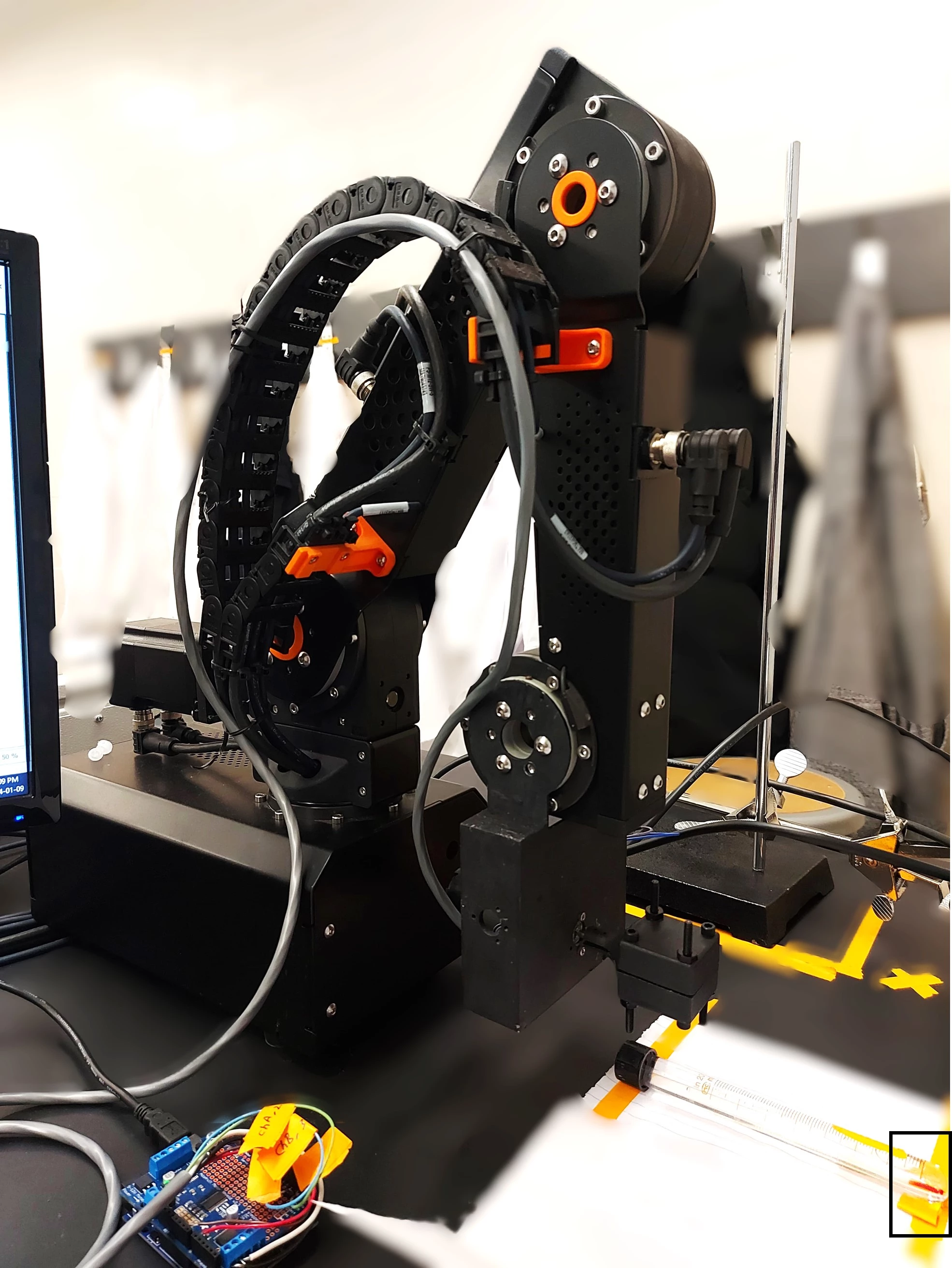 The robotic arm used in the study, with one of the filaments visible at the lower right
