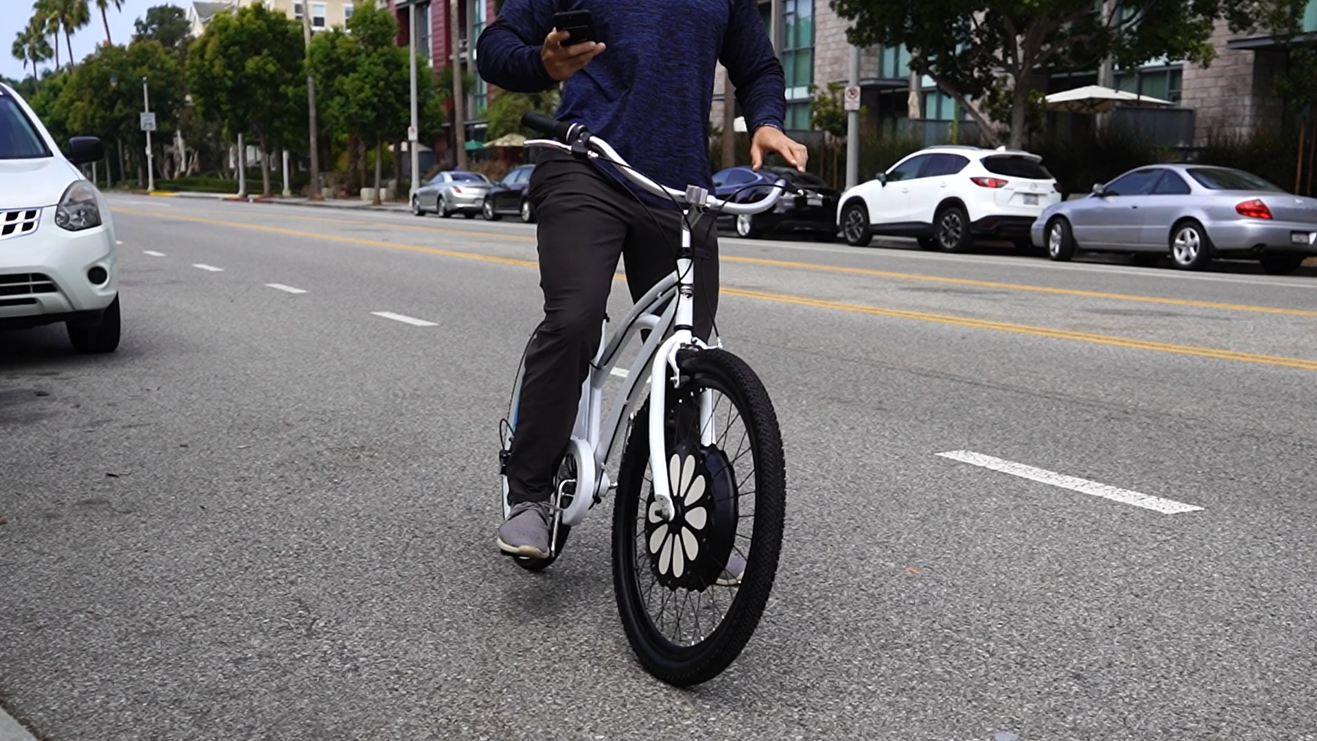 Making use of the EZ Wheelie's 250 W brushless hub motor is as simple as slotting the wheel into the forks of your ride