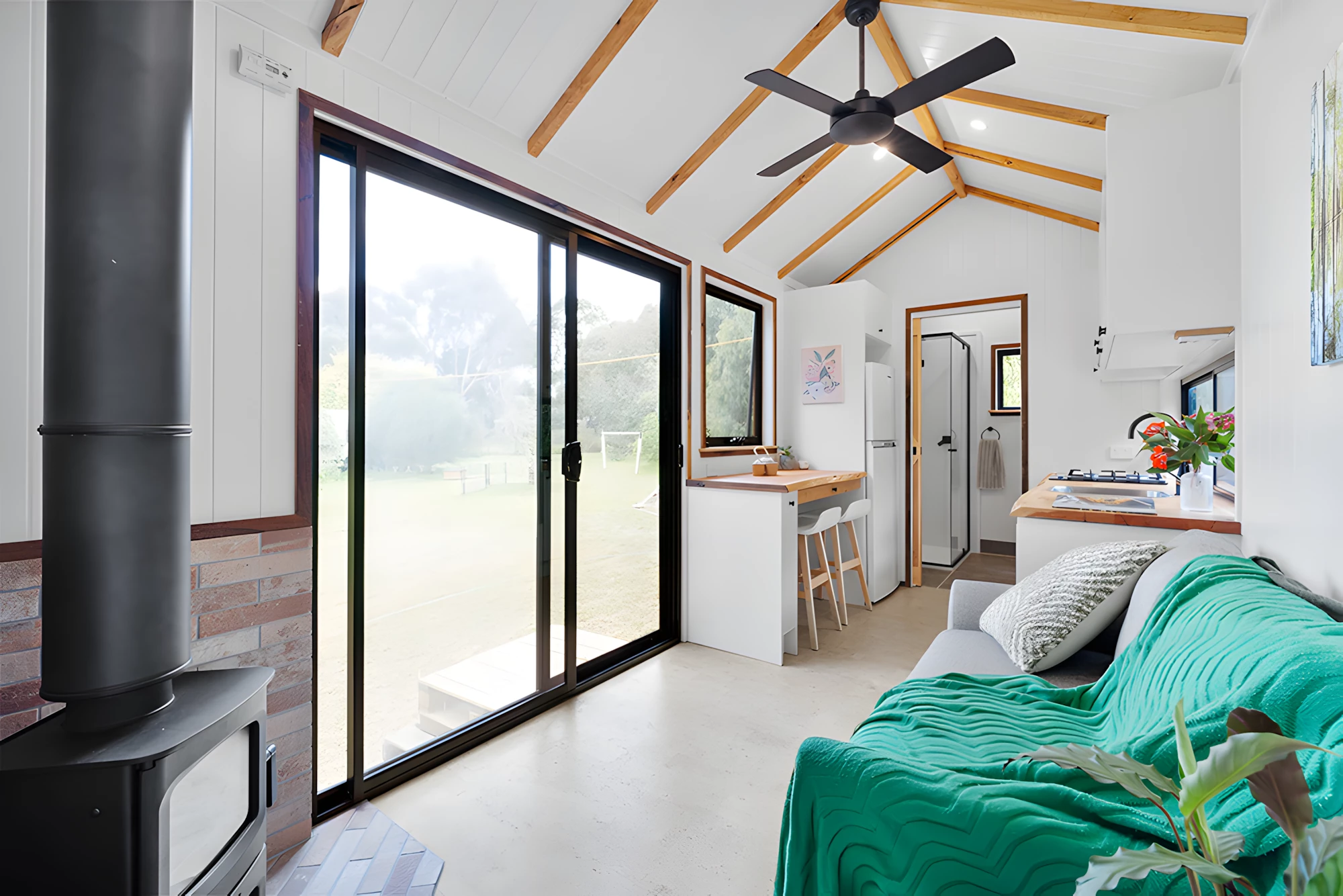 The Casuarina is accessed by sliding glass doors that help fill the interior with natural light