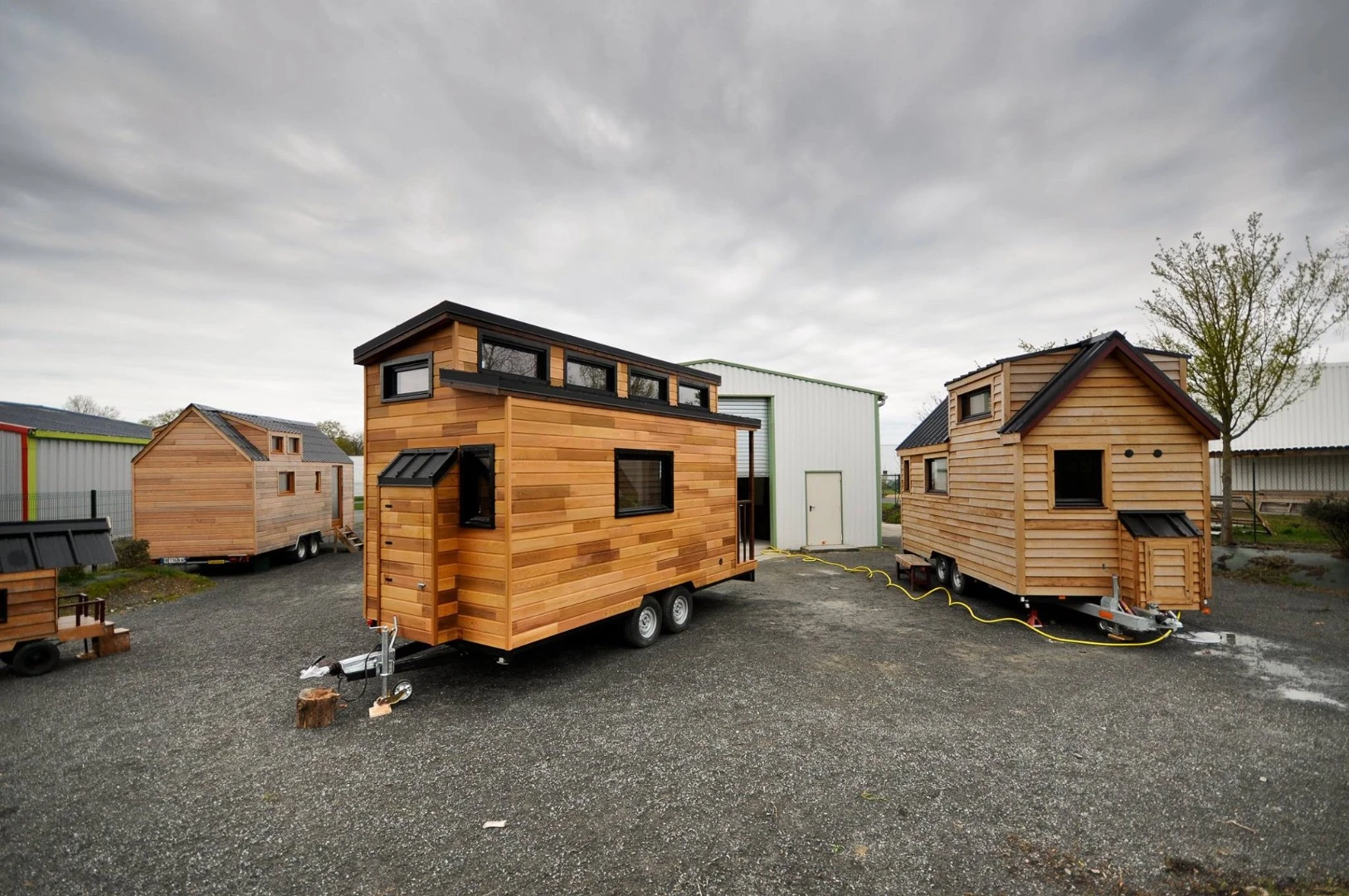 The cedar siding is enlivened by black detailing and roof