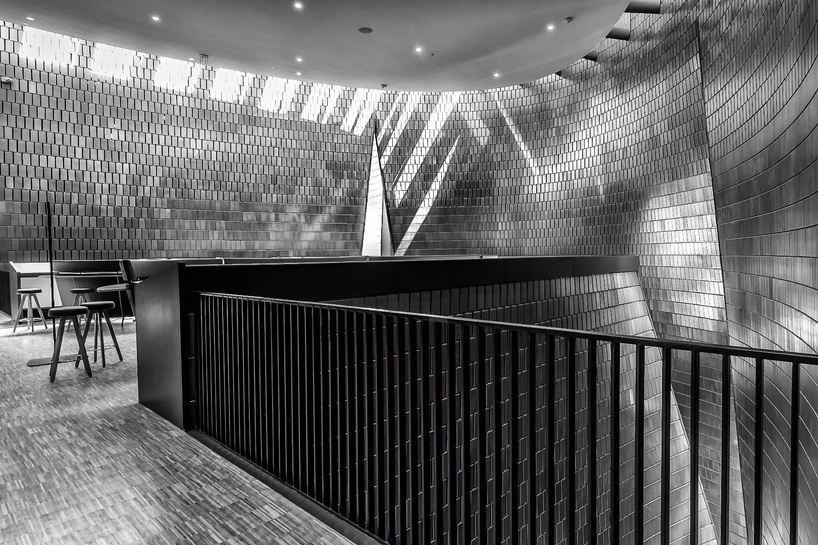 NMC's circular skylight, floating lounge and acoustic tiles greet visitors to the fifth floor