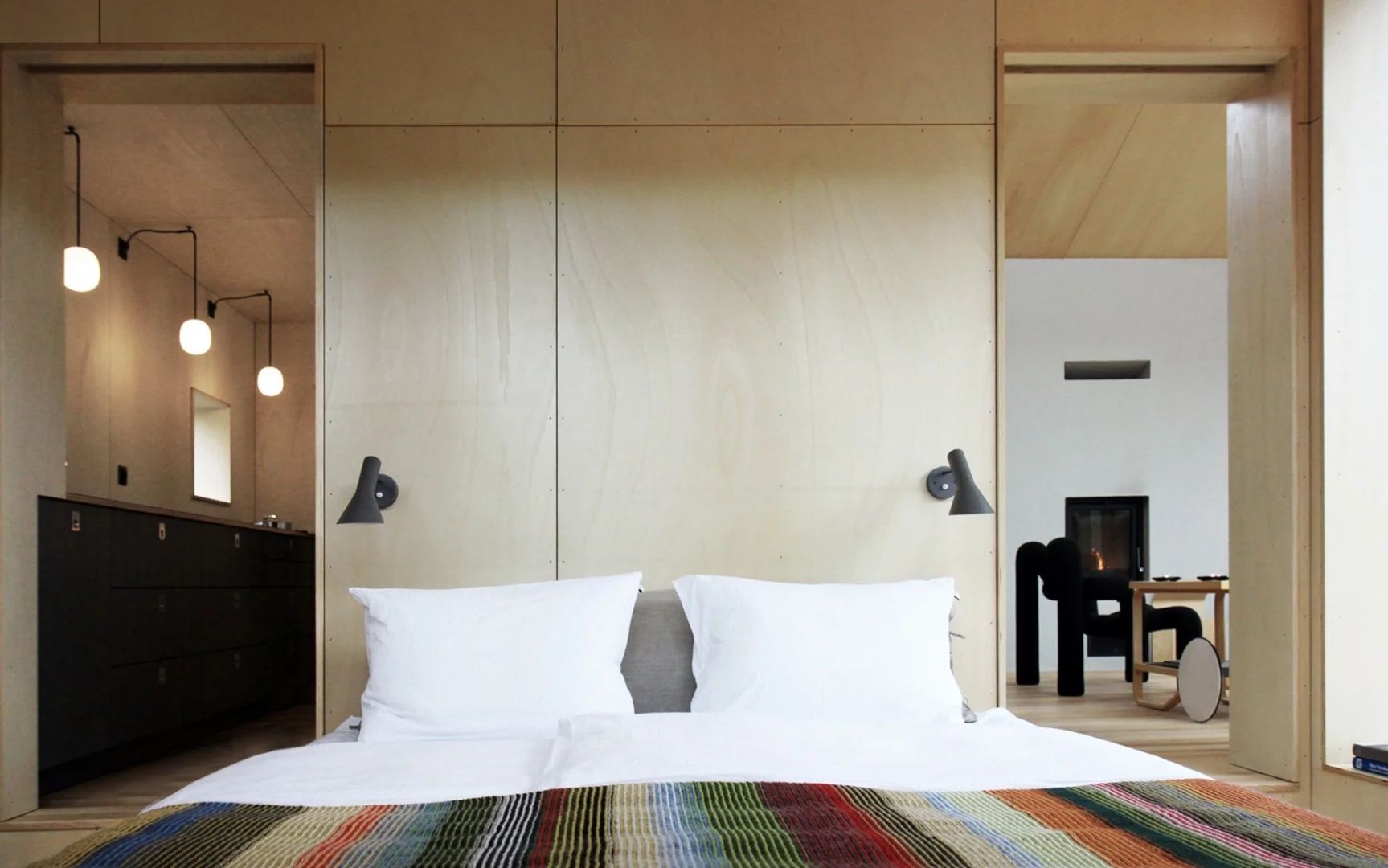 Cabin Vindheim split between a large living room, bedroom, a ski preparation room, mezzanine, and a small annex